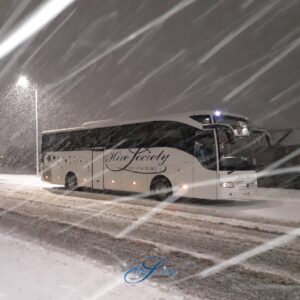 Hire Society Coach Hire bus in the snow