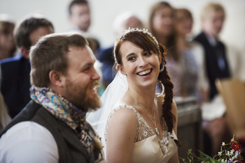 Laughing Bride and Groom at Wedding Chapel in Scotland