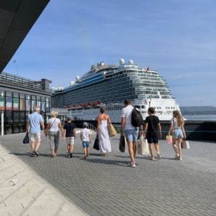 Family walking towards ship at Greenock cruise terminal Scotland