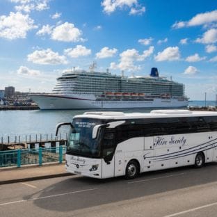 Greenock Coastal harbor with cruise ship and Hire Society Coach