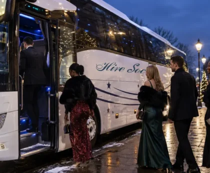 Christmas party coach hire Glasgow, private coach collecting a group from a festive venue at night